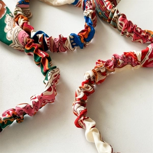 Detailed view of colorful printed elastic headband fabric texture and floral pattern
