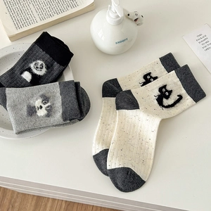 Japanese style animal pattern crew socks set with ribbed cotton texture in warm home setting