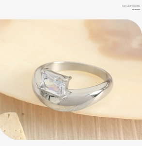 Macro shot of silver ring featuring a large rectangular emerald-cut zircon in a 4-prong setting