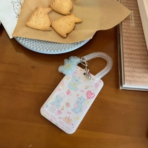 Detail of cute rabbit photocard holder with cartoon bear print and spring hook keychain