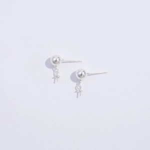 Macro view of S925 sterling silver ball stud earrings with hanging loop accessories