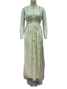 Close-up of beige V-neck dress with silver star sequins and shimmering glitter tulle