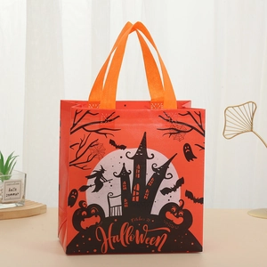 Detail of Halloween non-woven gift bag featuring castle, witch, and pumpkin prints