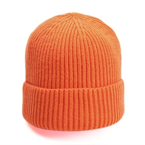 Detail view of bright orange ribbed knit beanie with soft texture and wide folded cuff