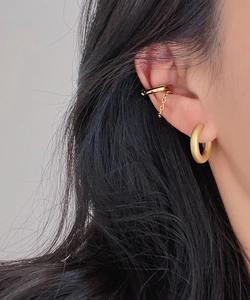 Close-up of 18k gold plated stainless steel matte hoop earring and ear cuff on ear