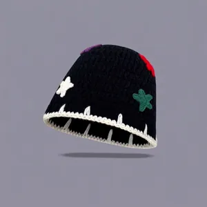 Handmade crochet bucket hat with colorful star appliques and contrast stitching detail