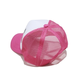 Detail of breathable pink mesh and white fabric on summer trucker hat for women