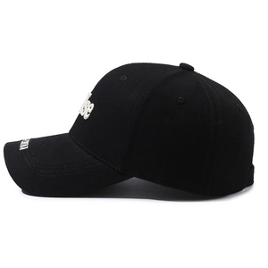 Black cotton baseball cap with white 3D letter embroidery and structured hard top design
