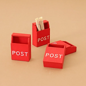 Three red wooden dollhouse miniature mailboxes with POST text and mini newspapers