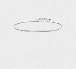 Close-up of adjustable S925 sterling silver bracelet featuring a curved diamond row