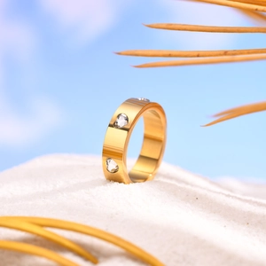 18K gold plated wide stainless steel ring with six heart shaped cubic zirconia stones