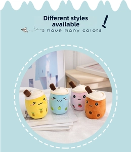 Detailed view of four colorful plush boba tea charms with cute fruit patterns and keyrings