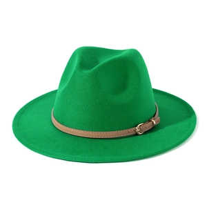 Detail view of green fedora hat with brown leather belt and golden metal buckle