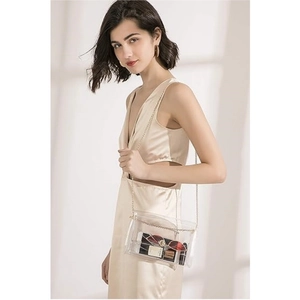 Clear stadium-approved crossbody bag with gold chain strap for concerts and events
