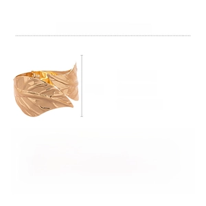 Detailed spec view of a gold leaf-shaped cuff bracelet with embossed vein texture