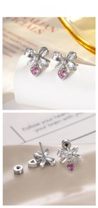 Detail of bow earrings with pink heart zircon and secure flat back screw closure