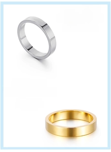 Close-up of 4mm 316L stainless steel rings in silver and gold with mirror finish