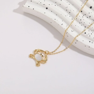 Elegant 14K gold plated crab pendant necklace featuring white shell and zircon accents