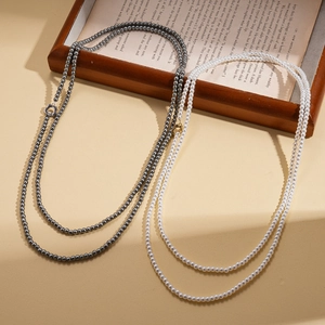 Long pearl necklace with floral OT clasp in white and grey, layered vintage style