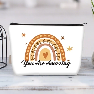 Detail view of white canvas makeup bag with You Are Amazing rainbow print and black zipper