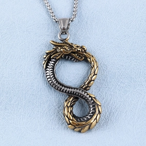 Detailed close-up of viking dragon pendant with intricate silver and gold dragon scales