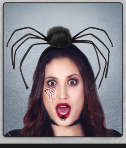 Detail of Halloween spider headband featuring flexible black fuzzy legs on a model