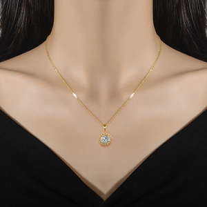 Elegant gold titanium necklace with hollow zircon pendant worn on a female model