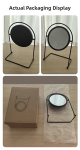 Detailed view of desktop vanity mirror with black metal stand and packaging box