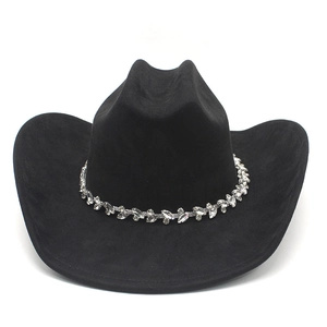 Detail of black faux suede western cowboy hat with sparkling rhinestone trim on band