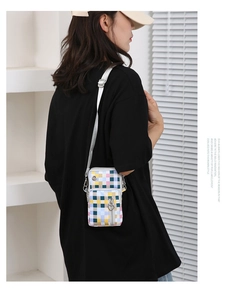 Detailed side view of oxford fabric phone bag with colorful checkerboard pattern and heart zipper