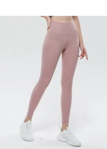 Detail of high waist fitness yoga leggings in dusty rose with seamless peach lift design