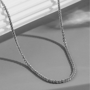 Polished silver popcorn chain necklace with a structured woven texture and minimalist style