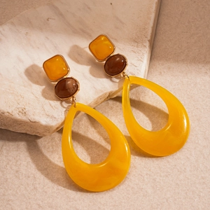 Vintage geometric resin hoop earrings with yellow drop shape and amber accents