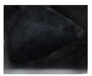 Detail shot of the thick fleece lining in a black winter baseball cap for warmth