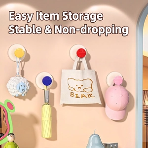 Colorful wall-mounted suction hooks set for hanging bags and accessories in bathroom