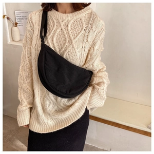 Minimalist black crescent crossbody bag with adjustable wide strap for casual wear