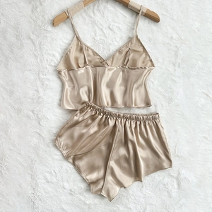 Champagne silk satin pajama set for women featuring camisole top and elastic shorts