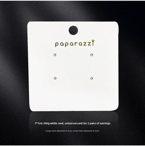 Close-up of a 7x7cm white square earring display card with Paparazzi branding logo