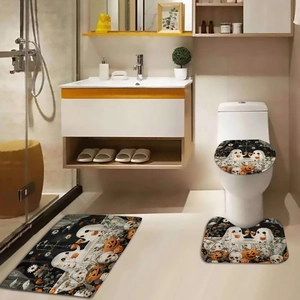 Three-piece Halloween bathroom mat set featuring orange pumpkins and white ghosts