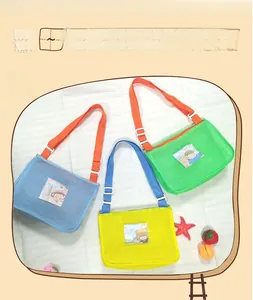 Close-up of colorful mesh shell bags for kids featuring cute cartoon character patches