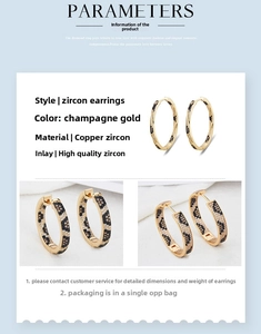 Detail of leopard print zircon earrings in champagne gold finish with premium settings