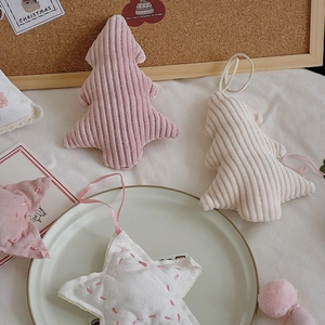 Pink and white corduroy Christmas tree and star fabric ornaments with festive embroidery