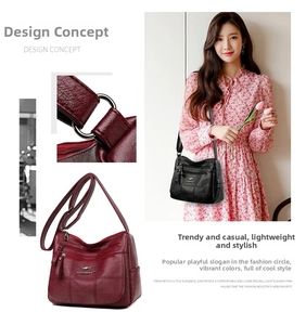 Close-up of litchi texture faux leather and multi-zipper compartments on crossbody bag