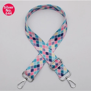 Detail of 38mm wide colorful geometric woven strap with polished silver metal swivel hooks