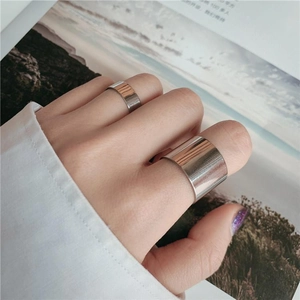 Polished silver stainless steel ring set showing wide and narrow band details