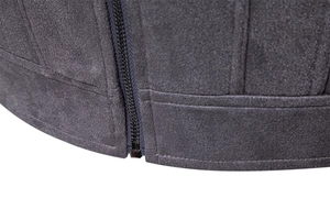 Detail of dark grey faux suede jacket hem with premium metal zipper and double stitching