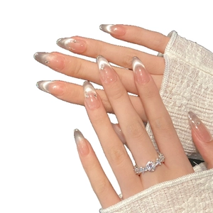 Elegant purple cat eye handmade press-on nails with rhinestone accents on model hand