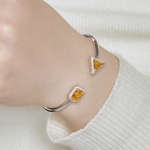 S925 sterling silver open bangle featuring yellow ice-cut cubic zirconia gemstones