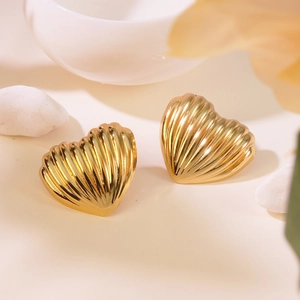 Elegant gold heart-shaped stud earrings with shell-like textured vertical ridges