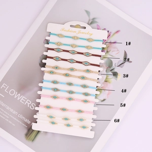 Detailed view of six colorful bohemian beaded bracelets neatly arranged on a display card
